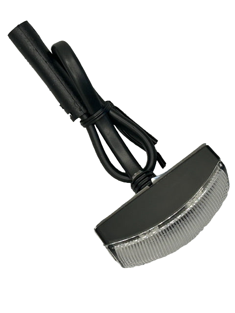 Small round light fixture with a black cord on a white background