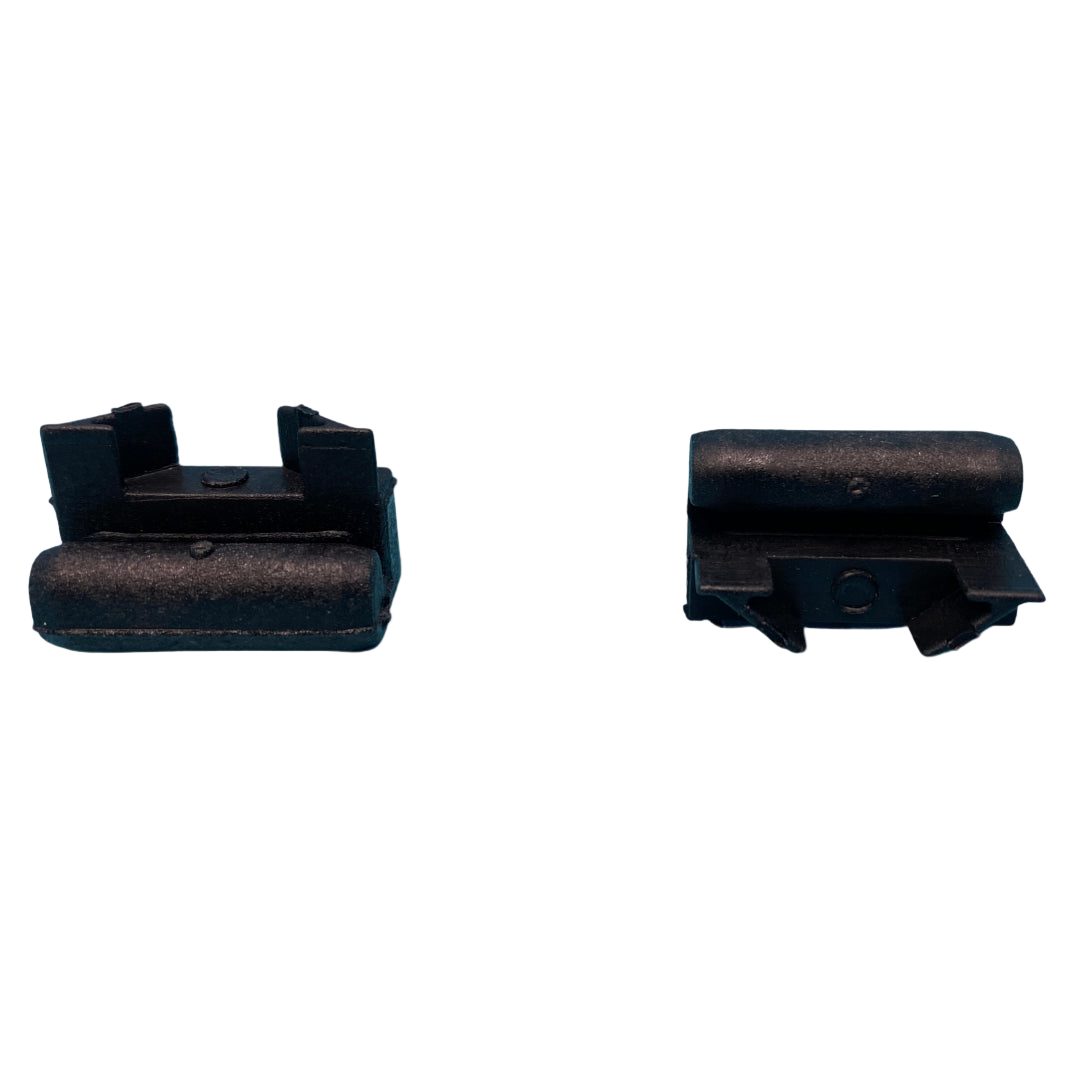 Two black rubber grommets on a white background