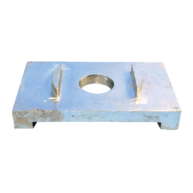 Metal component with a central hole on a black background