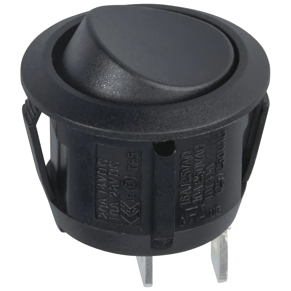 Black round push button switch on a white background